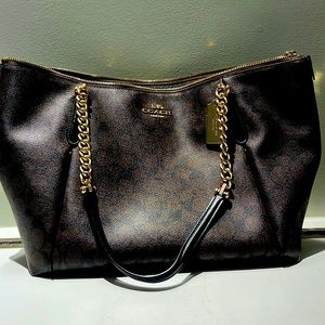 Coach logo print bag in dark brown with gold chain handle